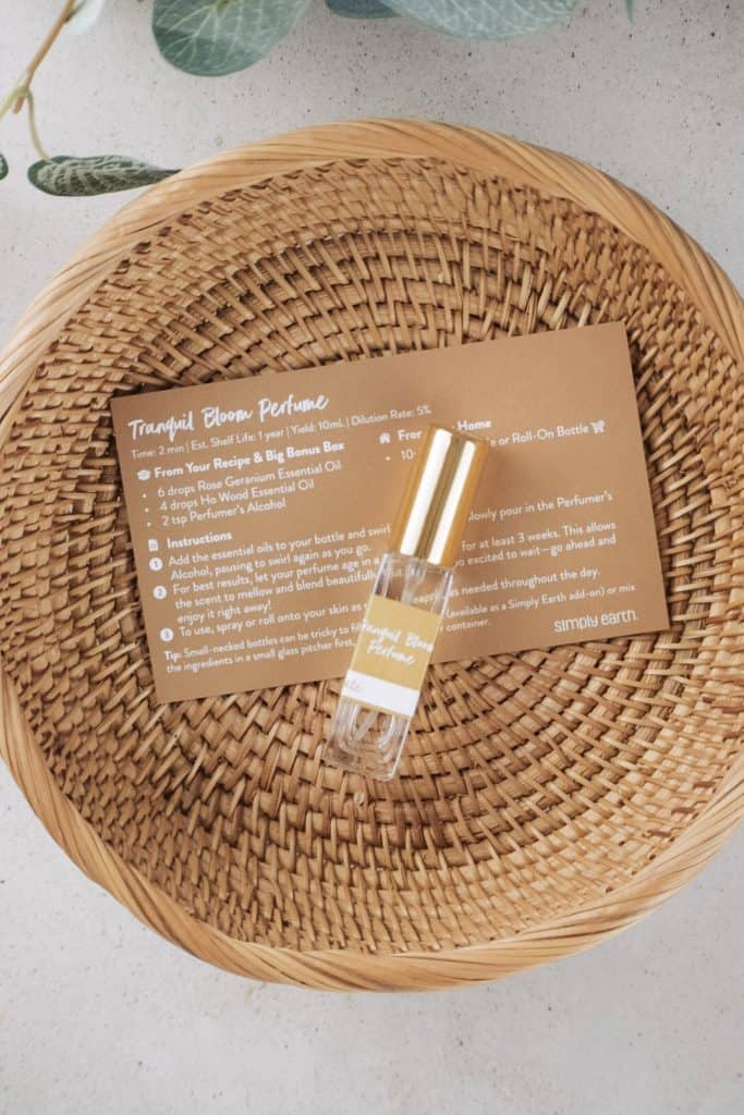 Homemade perfume in a rattan basket on the kitchen counter.
